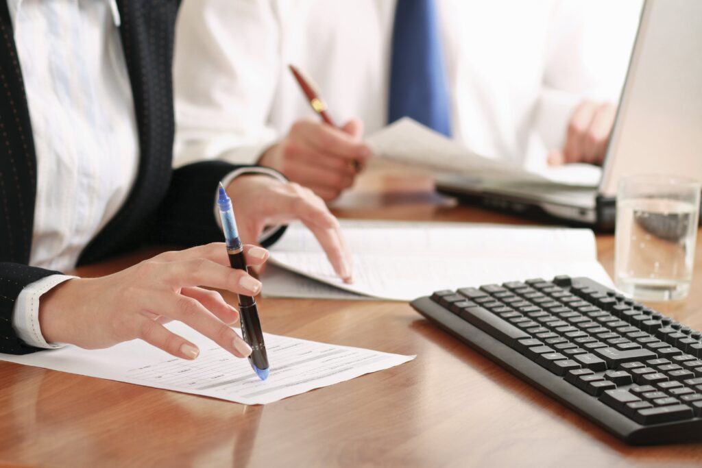 Two people filing their taxes.