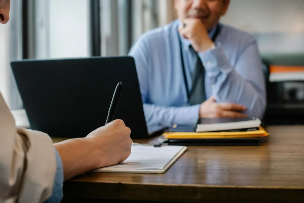 Client and attorney at a desk.